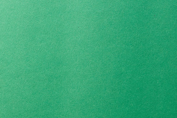 Clean green paper texture with simple surface. High resolution photo. Color paper, light green paper. Empty green paper backgrounds.