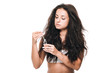 © LIGHTFIELD STUDIOS - sad brunette beautiful woman with damaged hair holding oil isolated on white