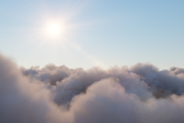 Wall Mural - flight through moving cloudscape with beautiful sun rays. beautiful realistic flight over cumulus lu