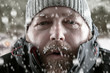 Man in snow storm close up
