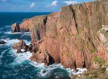 Sea Cliffs Near North Ham On Muckle Roe, Shetland, UK - The Rock Is Of The Muckle Roe Intrusion - Granite, Granophyric - Igneous Bedrock Formed In The Devonian Period.