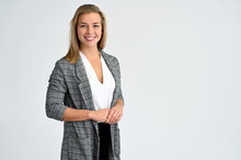 Close-up Portrait Of A Cute Caucasian Blonde Female Student Girl In A Gray Jacket On A White Background. Wide Smile, Happiness. It Is In Different Poses.