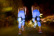© Westend61 - Long exposure photo of two women running in the city at night
