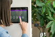 © Westend61 - Young woman with tablet with smart home control functions