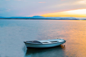Naklejka na meble boat in the sea at sunset