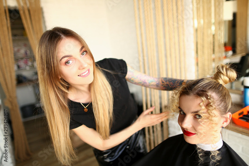 Hairdresser Styling Curls And Bun Girl Hairstyle Professional