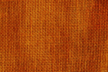 Wall Mural - Orange color burlap background. Detailed rough sackcloth fabric texture. Closeup. Focus stacking