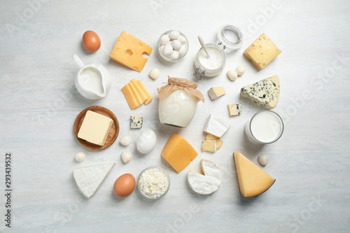 Cuadros en Lienzo Different delicious dairy products on white table, flat lay