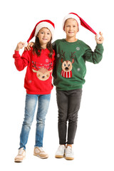 Sticker - Little children in Christmas sweaters and Santa hats on white background