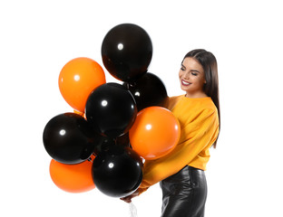Wall Mural - Beautiful woman with balloons on white background. Halloween party