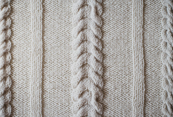 Close up hand made knitted ornament background.