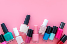 Choose Nail Polish. Polish Bottels On Pink Background Top View Copy Space