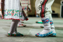 Close Up Of Wool Socks On Legs Of Young Romanian Female And Male Dancers In Traditional Folkloric Costume. Folklore Of Romania
