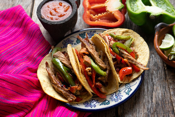 Wall Mural - Tacos of mexican beef fajitas also called 