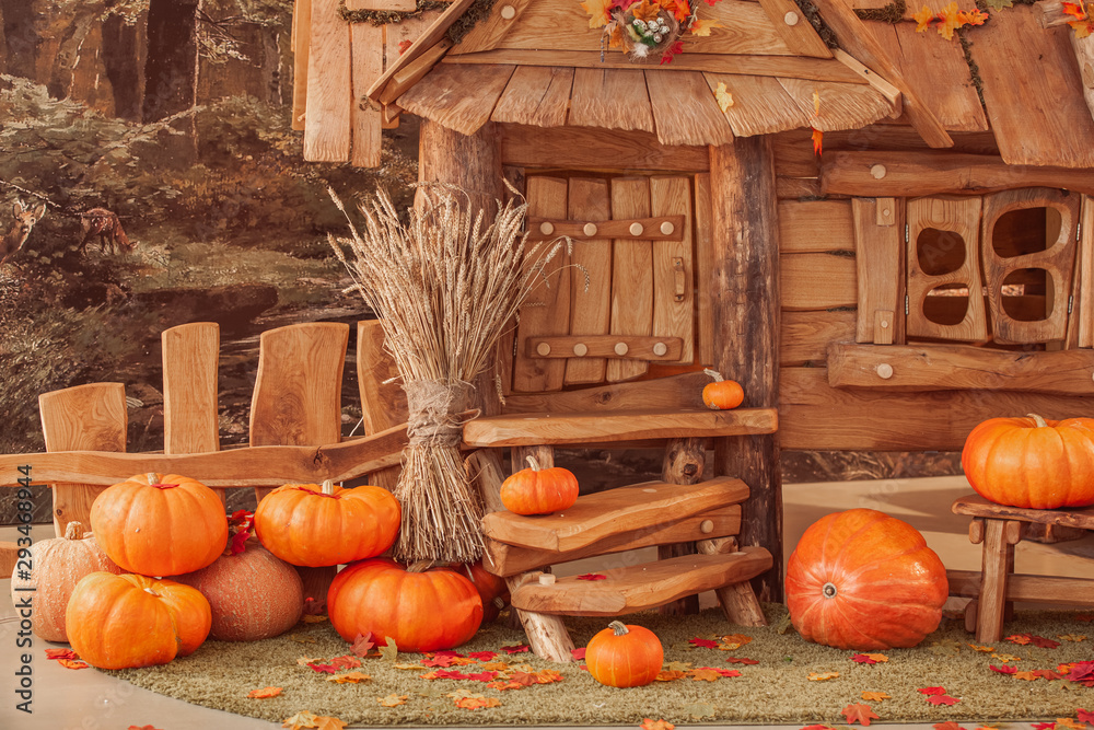 fairytale oak house, interior decor, autumn background with pumpkins. - obrazy, fototapety, plakaty 