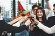 © Mongkolchon - group of business people enjoying party and clinking glass of champagne and wine together to celebrate corporate success and new year event