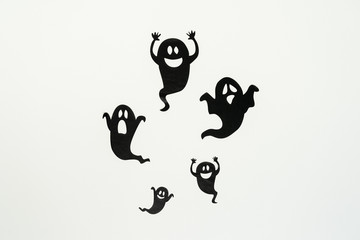Fototapete - Table top view aerial image of decoration Happy Halloween day background concept.Flat lay accessories essential object to party the black ghost on rustic white stone.Space for creative design text.