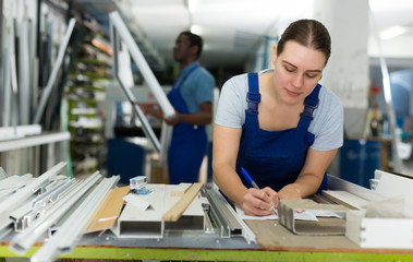 Young woman master is construction modern windows