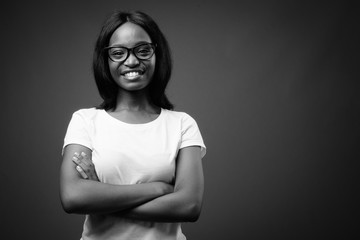 Young beautiful African Zulu woman against brown background