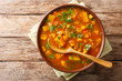 © FomaA - Traditional thick sweet potato soup with lentils close up in a bowl on the table. Horizontal top view