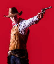 Man Wearing Cowboy Hat, Gun. West, Guns. Portrait Of A Cowboy. American Bandit In Mask, Western Man With Hat. Portrait Of Farmer Or Cowboy In Hat