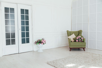 Wall Mural - green vintage chair in the interior of an empty white room