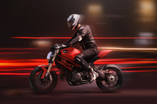 Motorcycle Rider Racing In Red Colors With Motion Blur