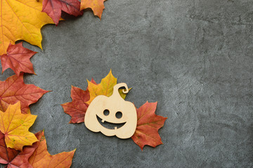 Wall Mural - autumn composition. maple leaves and decorative pumpkin. flat lay, top view