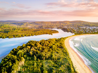 Early morning light over coastal beaches and river