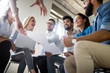 © NDABCREATIVITY - Successful happy group of people learning software engineering and business during presentation