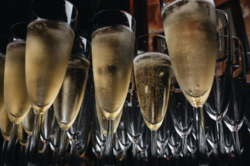 Close-up the glasses of the champagne on a table