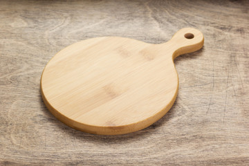 Poster - cutting board on wooden  table background