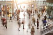 Blurred travelers and people in motion in Central Station or Airport
