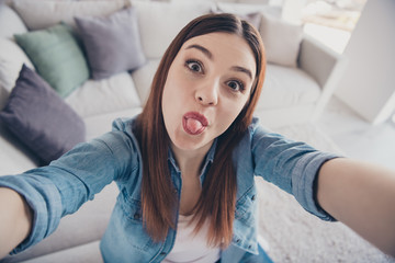 Poster - Close up photo of funny funky crazy girl have video call with her best friends show tongue take selfie enjoy summer spring vacation wear denim jeans clothes indoors