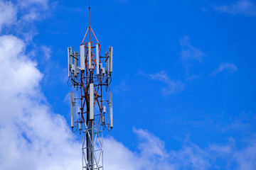 Telecommunication telephone signal transmission tower with beautiful blue sky background