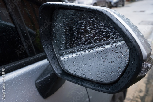 The rain that is on the car side mirror