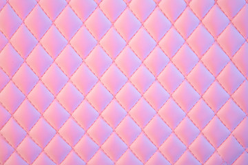 Geometric diamond pattern quilted PU leather in neon light