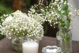 Fototapeta Nowy Jork - Wedding decor. Flowers, candles. Wedding paraphernalia. Rustic style.