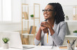 © Prostock-studio - Young Afro Business Lady Smiling Sitting In Modern Office