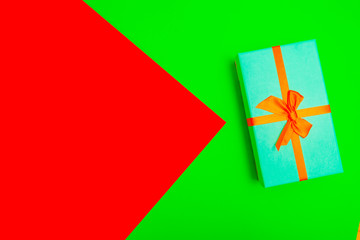 Poster - gift box with ribbon on a colorful background. view from above.