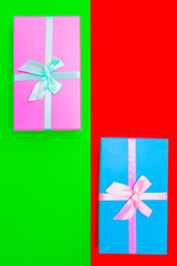 Poster - colored boxes with ribbons on a colorful background. view from above.