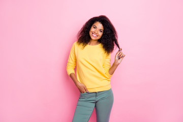 Sticker - Portrait of positive cheerful lovely african girl have weekends listen look enjoy feel satisfied wear trend good look outfit sweater pants isolated over pastel color background