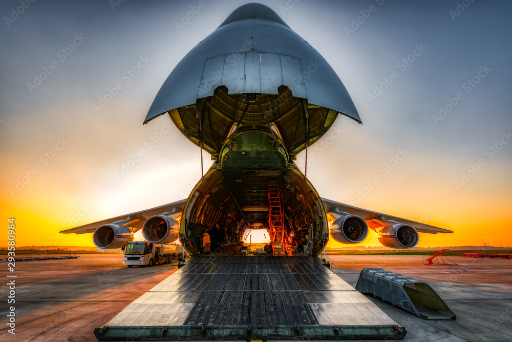 antonov an-124 on the ground with wide open freight room - obrazy, fototapety, plakaty 