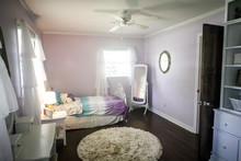 Young Girl's Light Purple Lavendar Lilac Bedroom With Hardwood Floors And Windows