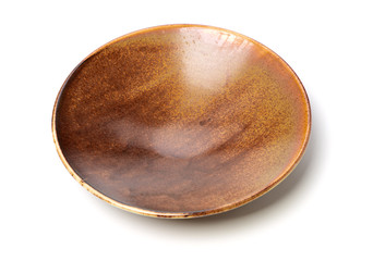 Wall Mural - Empty brown earthenware plate on white background