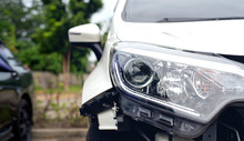 Car Accident Damaged On The Road With Soft-focus And Over Light In The Background
