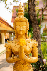 Wall Mural - Buddha statue at Wat Pha That Luang temple in Vientiane, Laos