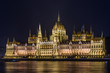 Hungarian Parliament Building at night reflected in Danube