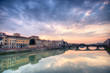 Sunset over the Arno river in Florence with Ponte Vecchio