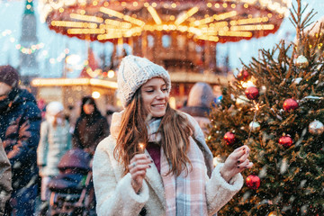 Girl walking on Christmas Market on Red Square in Moscow